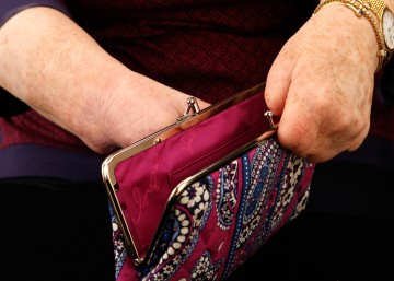 Another close up shot of Cindy's hands with an open kiss clasp purse.